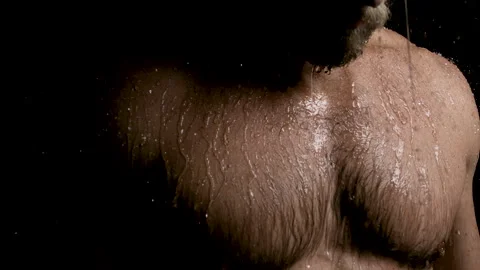 Reverse Drops of Water Falling on Shirtless Man in Slow Motion Stock Footage 270315579
