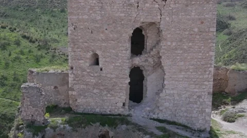 Reverse flight with a close-up of a break in the tower where we see a Stock Footage 275163085