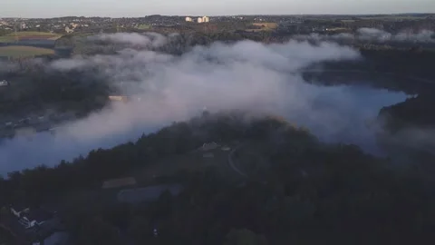 Reverse flight over misty landscape in the morning 스톡 동영상 203651316
