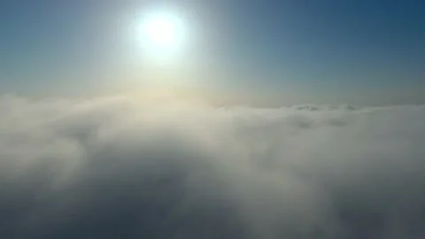 Reverse flight through clouds Stock Footage