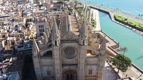 Reverse frontal panoramic view of Palma de Mallorca's Gothic Roman Cathedral Stock Footage 166475866