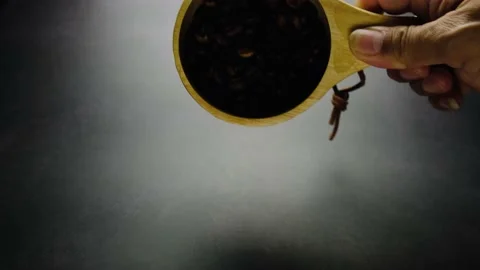 Reverse image. Coffee beans roasted from the floor to the coffee mug. Stock Footage 232779246