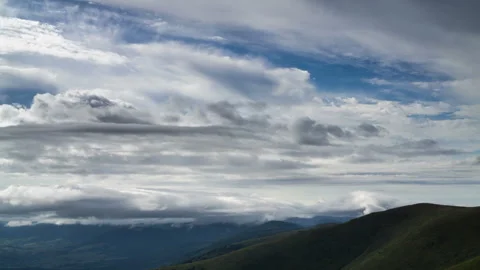 Reverse morning movement of clouds over the mountains. Stock Footage 264109991