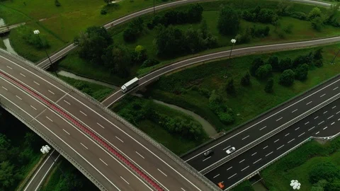 Reverse motion beautiful urban circle ring road junction with busy traffic Stock Footage 111220386
