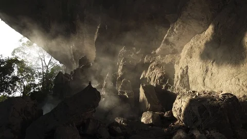 Reverse Motion Blowing Fire Smoke in Stone Cave Stock Footage 129306501