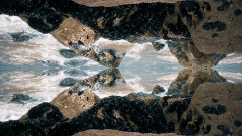 Reverse Motion Ocean Waves Hitting Rocks Mirror Effect  Stock Footage 100356342