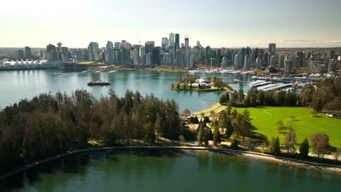 Reverse out over stanley park and vancouver yacht club Stock Footage 239075597