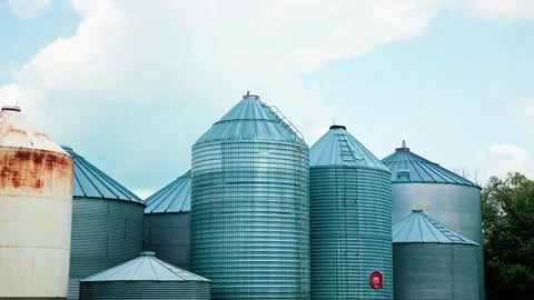 Reverse Parallax Drone Shot of Grain Silos Against Blue Summer Sky Stock-Footage 342015152