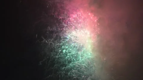 Reverse playback of colorful fireworks exploding in the dark night sky, cre.. Stock Footage 321301202