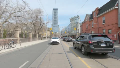 Reverse POV driving urban downtown Toronto city streets with car traffic Stock Footage 151858009