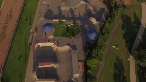 Reverse Pull Away of Skatepark to Reveal City Skyline Stock Footage 329556101