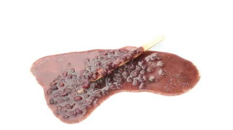 Reverse of red bean popsicle melting on a white background time-lapse, 4K Vid Stock Footage 52360584