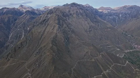 Reverse Reveal of Colca Canyon’s Massive Mountain Withstanding The Elements and Stock Footage 325505532