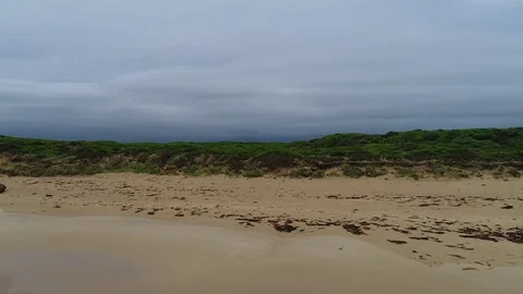 Reverse reveal of waves and clouds by drone Stock Footage 84311598