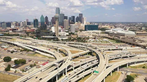 Reverse shot of Dallas Traffic approaching a cloverleaf Stock Footage 115996457