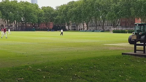 Reverse Shot Of Men Playing Cricket In The City Of London In The United Stock Footage 112184566