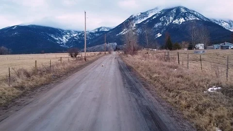 Reverse shot over dirt road Stock Footage 124927242
