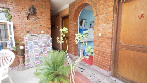 Reverse shot through plants at Nepal guesthouse Video stock 91135851
