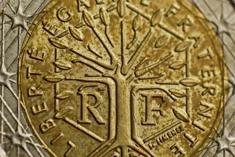 Reverse side of a coin two euro close-up isolated on black background. Detail Stock Photos