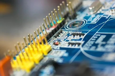 The reverse side of colorful microboard on a blue background, electronic boar Stock-Fotos