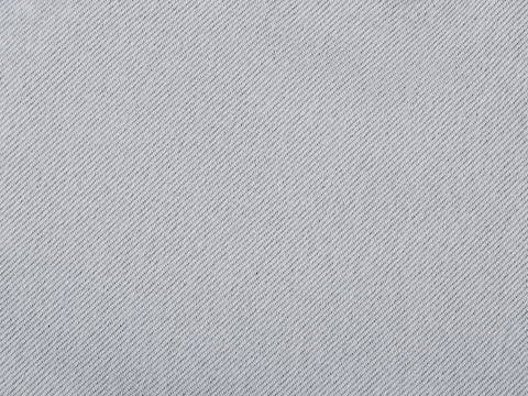 Reverse side of the fabric. High-quality clothes. Texture, background is grey Stock Photos
