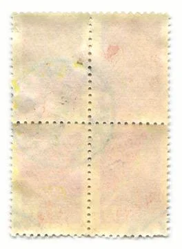 The reverse side of a postage stamp. Stock Photos