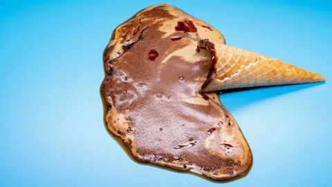 Reverse of side view chocolate ice cream cone melting timelapse on blue Stock Footage 108701582