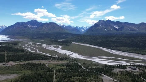 Reverse on Snowy Mountains and Lush Green Valley - Alaska Stock Footage 217849081