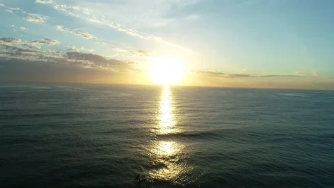 Reverse sunrise ascent over water with canoes, 4k, 25FPS, Australia, NSW Stock Footage 102357242
