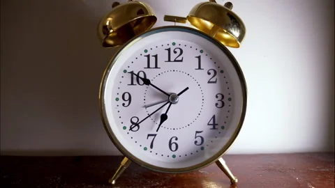 Reverse Time-Lapse of a Golden Antique Clock with Dramatic Lighting Stock Footage 336321706