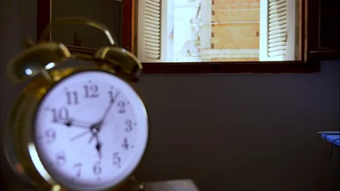 Reverse Time-Lapse of a Golden Antique Clock With Focus on an Open Window Stock Footage 336718147