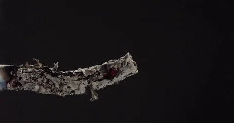 Reverse Time lapse, smoking and Lighting a cigarette, macro, profile Stock Footage 71785235