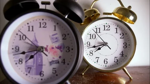 Reverse Time-Lapse of Two Antique Clocks With Selective Focus Stock Footage 336406213