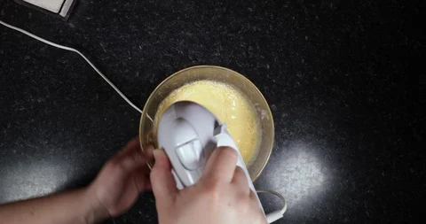 Reverse Time Lapse Of Woman Continuing To Mix Mixture Using Electric Mixer Video stock 109214187