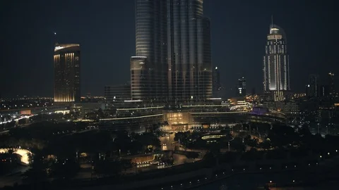 Reverse track from base of Burj Khalifa at 60m, night. Stock Footage 98957816
