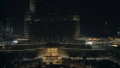Reverse track from base of Burj Khalifa at 60m, night. Stock Footage 98958172