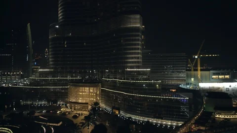 Reverse track from base of Burj Khalifa at 60m, night. Stock Footage 98959544