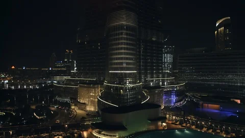 Reverse track from base of Burj Khalifa at 60m, night. Stock Footage 98959561