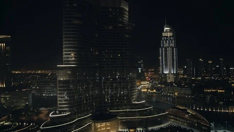 Reverse track from base of Burj Khalifa at 60m, night. Stock Footage 98959677