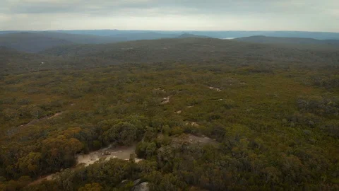 Reverse tracking shot of Mt Wondabyne peak aerial Video stock 119995584