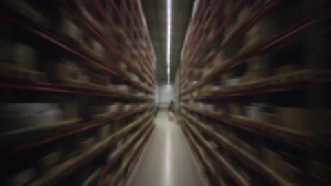 Reverse view between the racks in a warehouse. Stock Footage 150332276