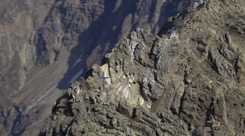 Reverse zoom from helicopter showing mountain cross and hikers, Tyrol / Austria Stock Footage 22962628