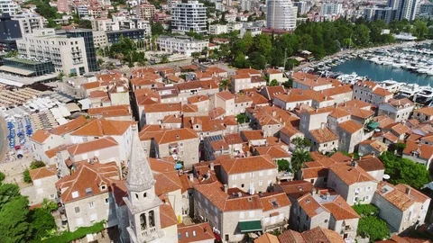 Reversible camera flight over Old European city with red-tiled roofs and marina Stock Footage 80669604