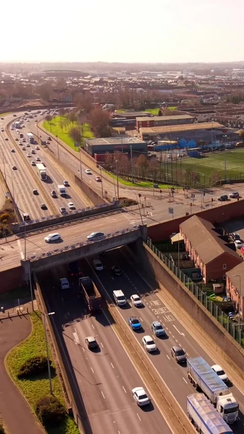 Reversing 60FPS social ratio vertical aerial video of Belfast and the M1 Stock Footage 332379286