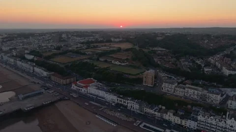 Reversing Aerial Shot Pulling Back Over Hastings Pier at Sunset Stock Footage 340603678