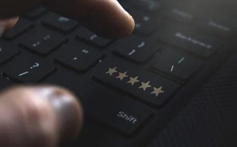 Review 5 start button on keyboard. Concept for reviewing services online Stock Photos