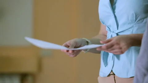 Review of documents and handshake closeup Stock Footage 45392959