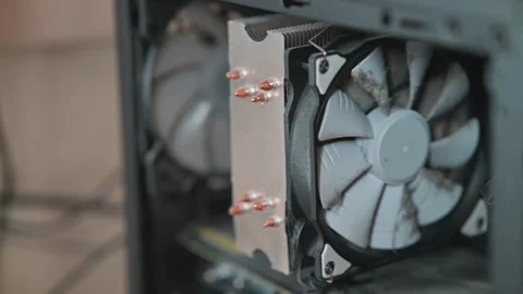 Review of a dusty and dirty computer cooling fans in a desktop case, Stockbeeldmateriaal 337112398