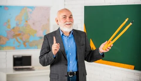 Review Errors. bearded tutor man draw with compass on blackboard. back to school Stock Photos