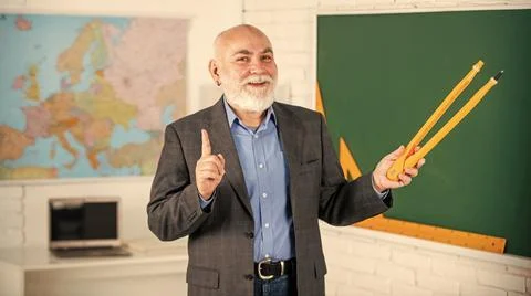 Review Errors. bearded tutor man draw with compass on blackboard. back to school Stock Photos